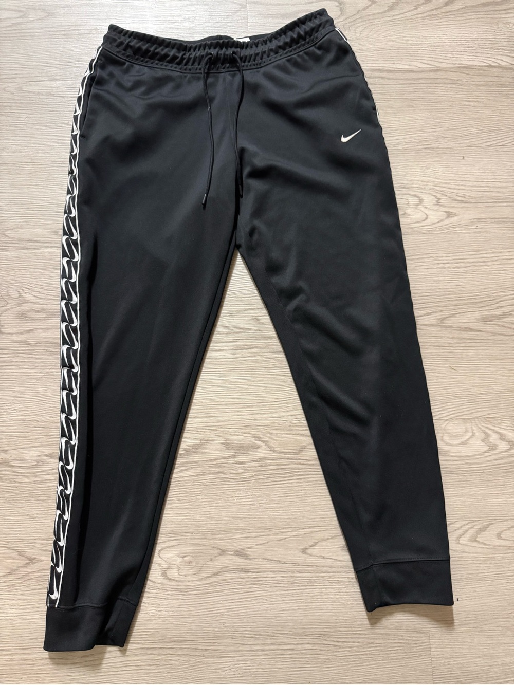 Nike Black Joggers with White Swoosh and Side Tape